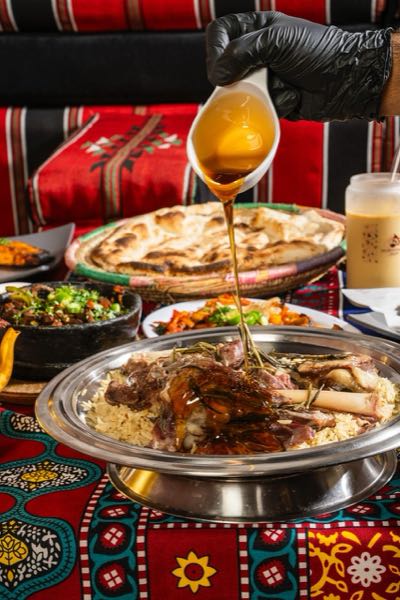 Honey poured over lamb mandi